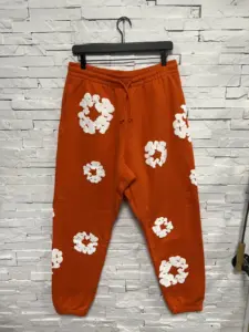 Denim Tears The Cotton Wreath Sweatpants Orange – stylish streetwear unisex sweatpants in orange color